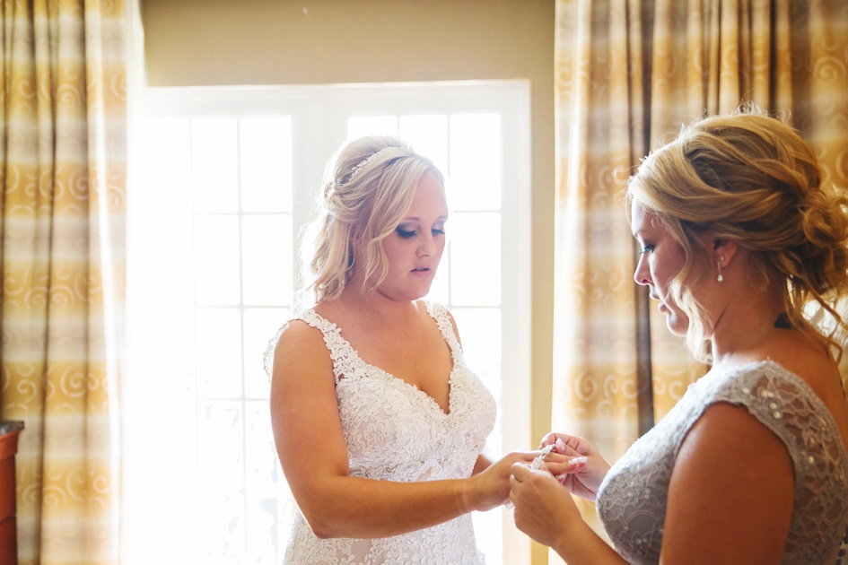 Bloomington Illinois Summer Wedding Photography, bride getting into dress for wedding