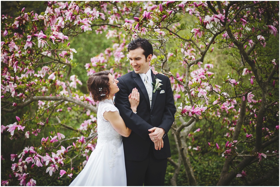 bloomington wedding photography, Pink flowering trees surrounding bride and groom.