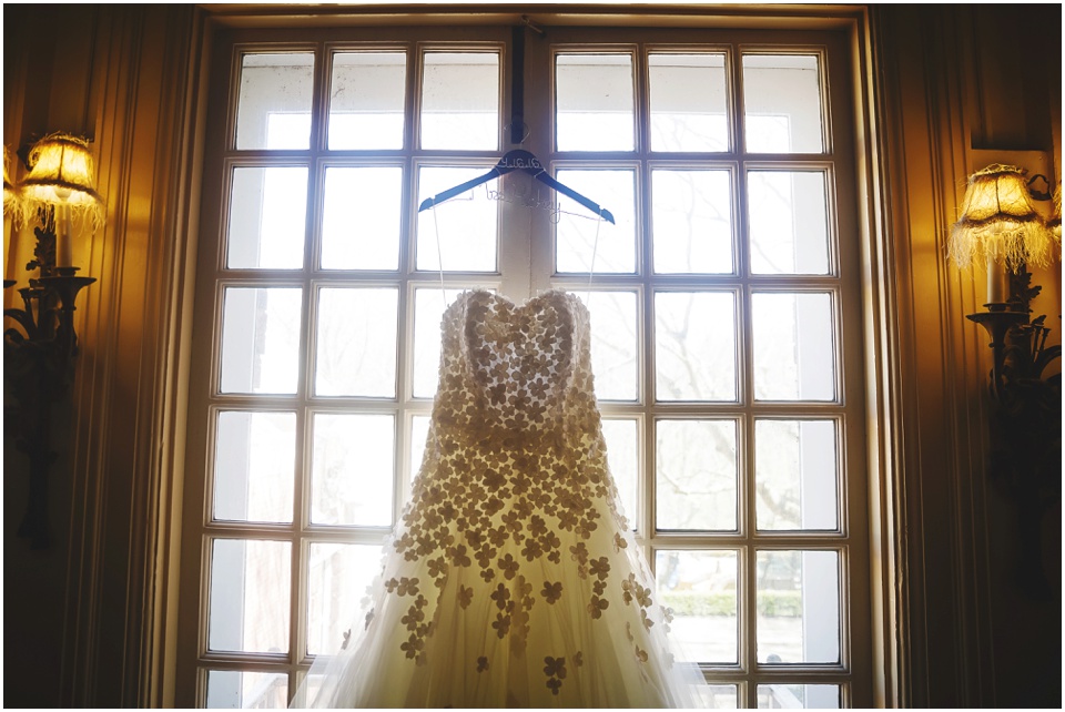 Bridal gown hanging on a window at Allerton Park Mansion.