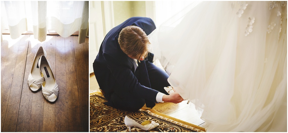 Bride's brother puts on her wedding shoes.