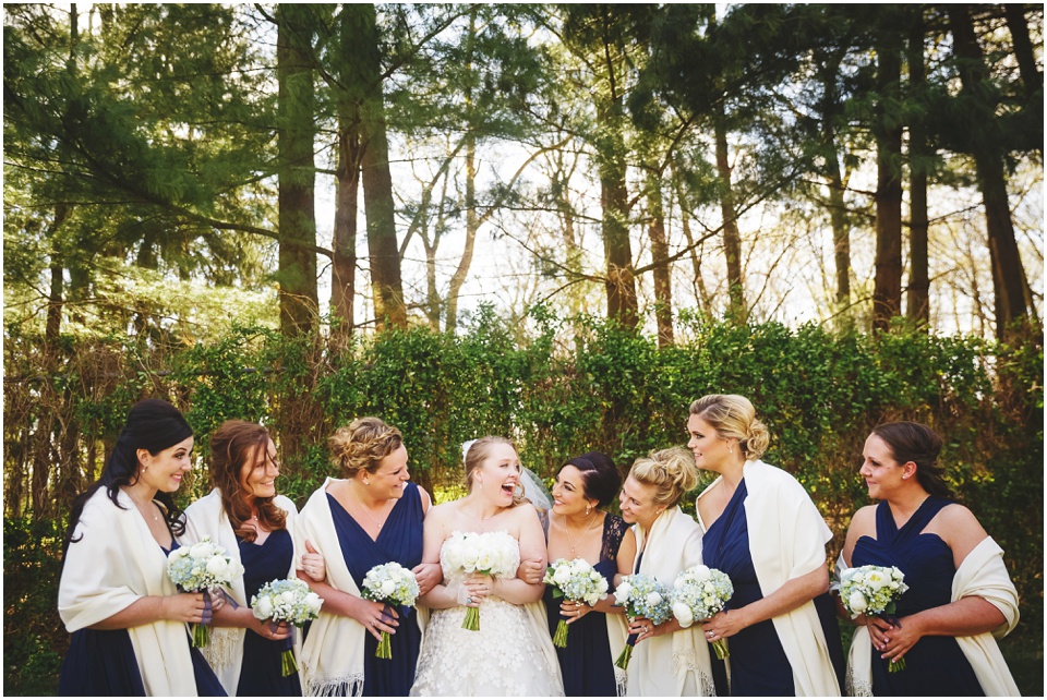 Bride and bridesmaids laughing by Allerton Park Wedding photographer Rachael Schirano.
