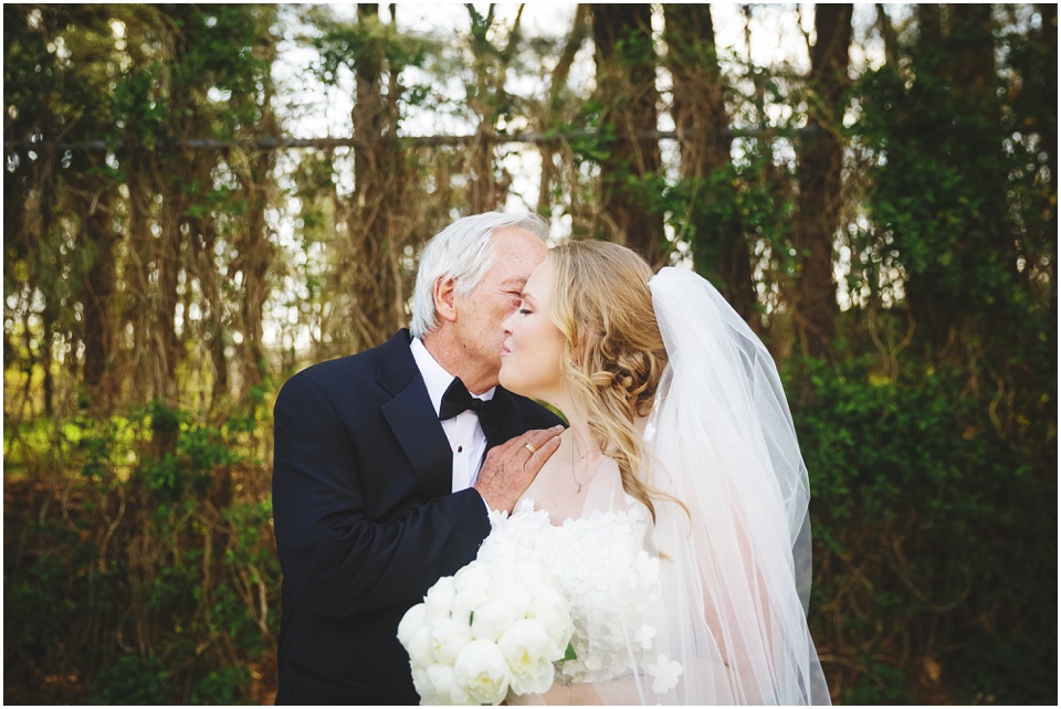 Bride kisses grandfather on wedding day at Allerton Park.
