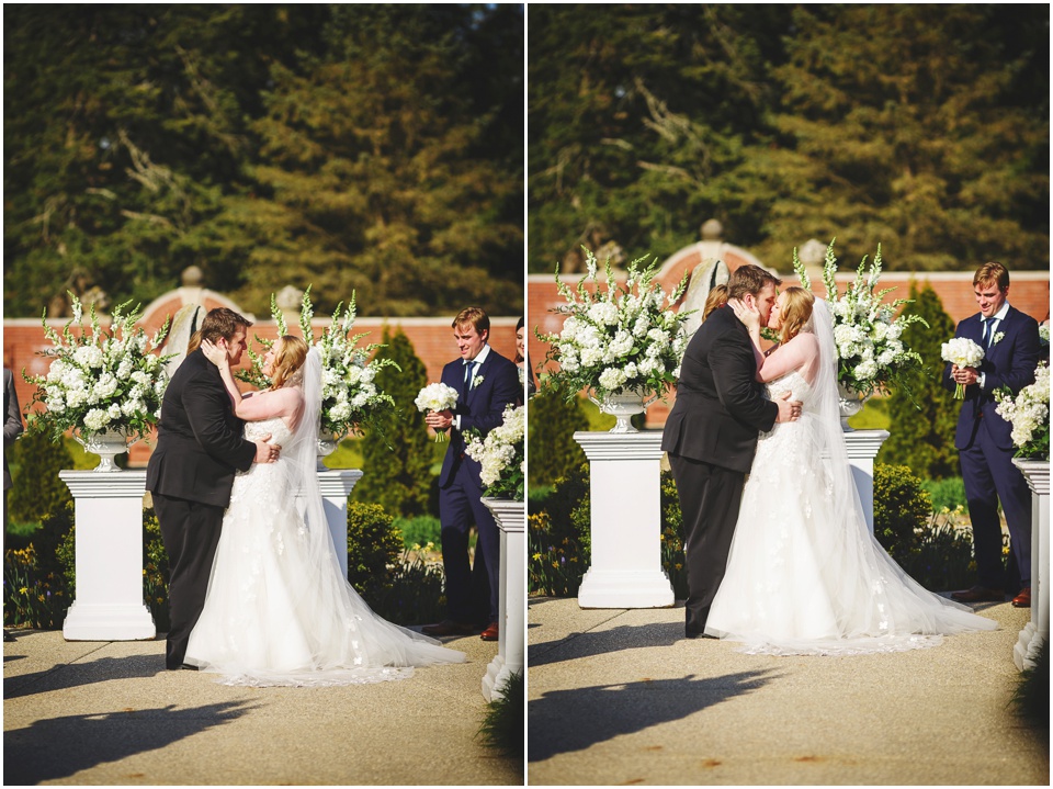 Bride and Groom first kiss in the Gardens at Allerton Park Wedding.