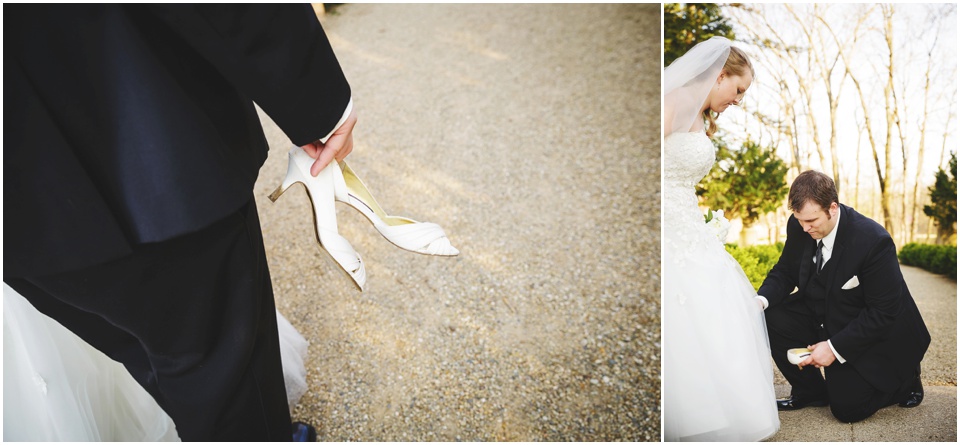 Grooms puts on Bride's wedding shoes at Allerton Park Wedding.