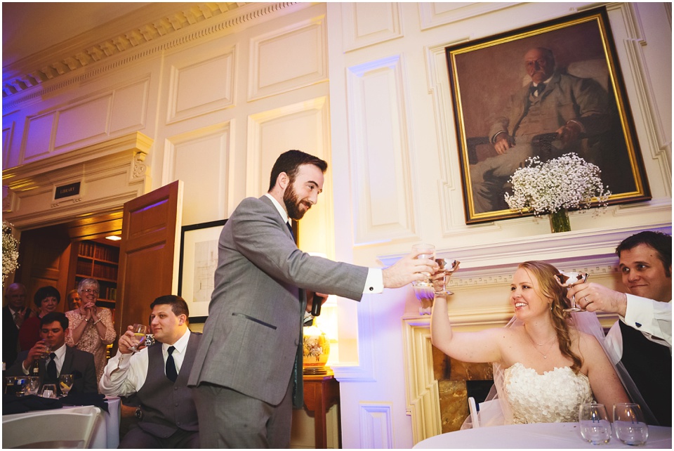 Bride and groom cheers a groomsmen after speech during wedding reception at Bride and groom laughing during a toast at Allerton Park Mansion.