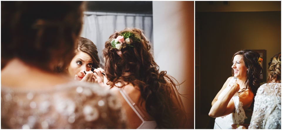 Bride putting on makeup and dress on wedding day.