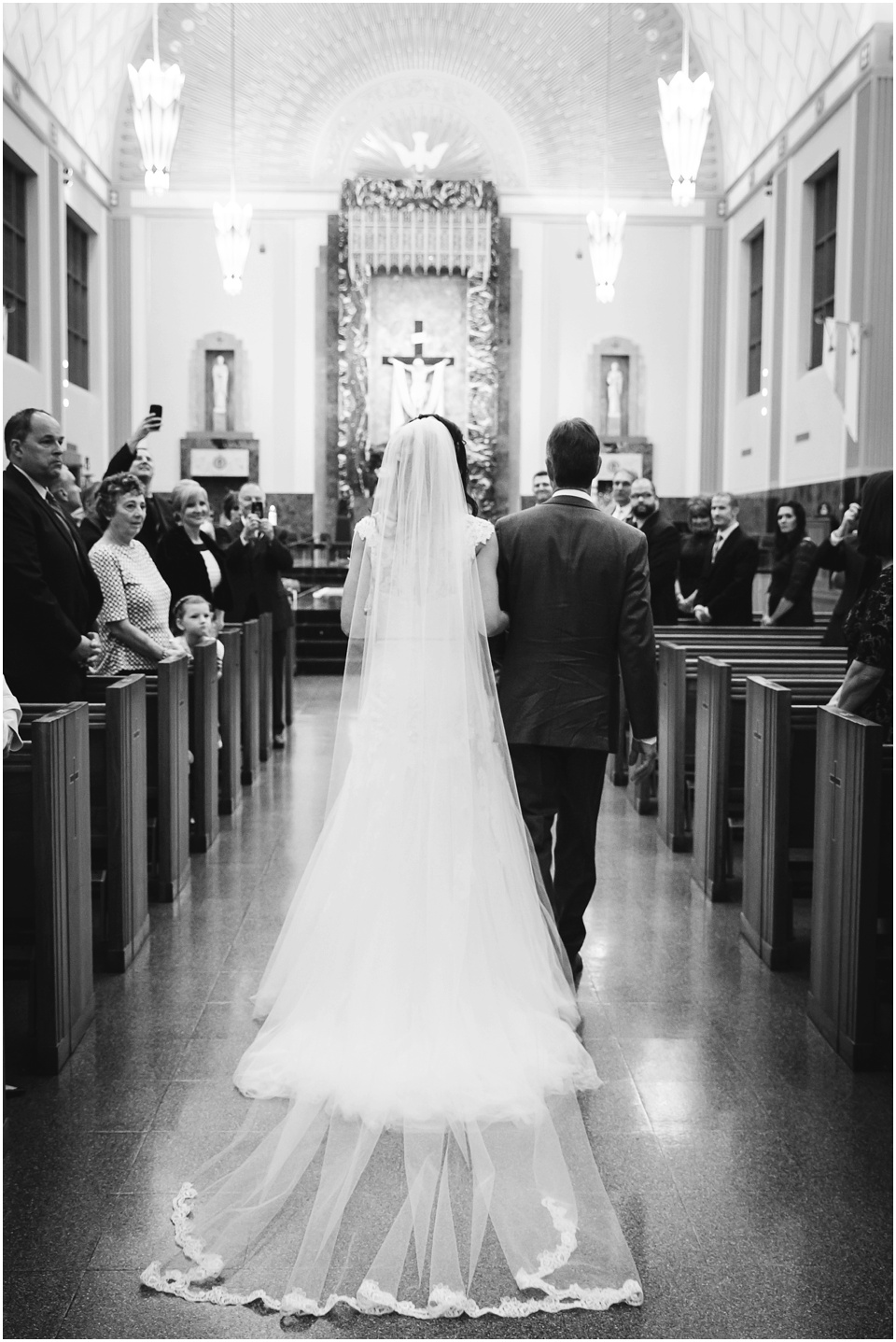 cathedral wedding photography, Bride walking down the aisle during church wedding.