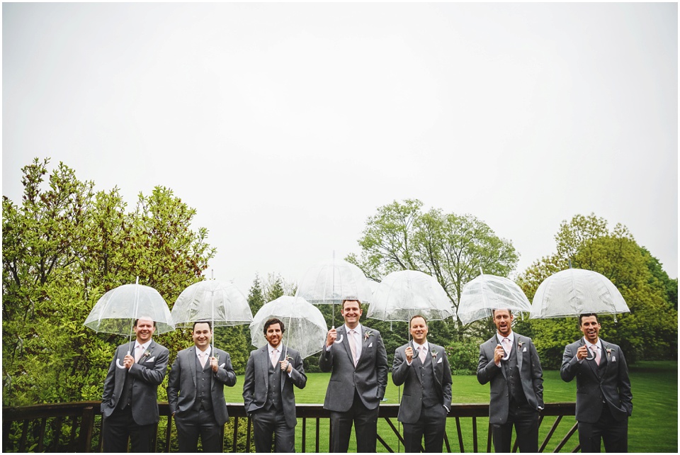 cathedral wedding photography, Groomsmen with umbrellas.