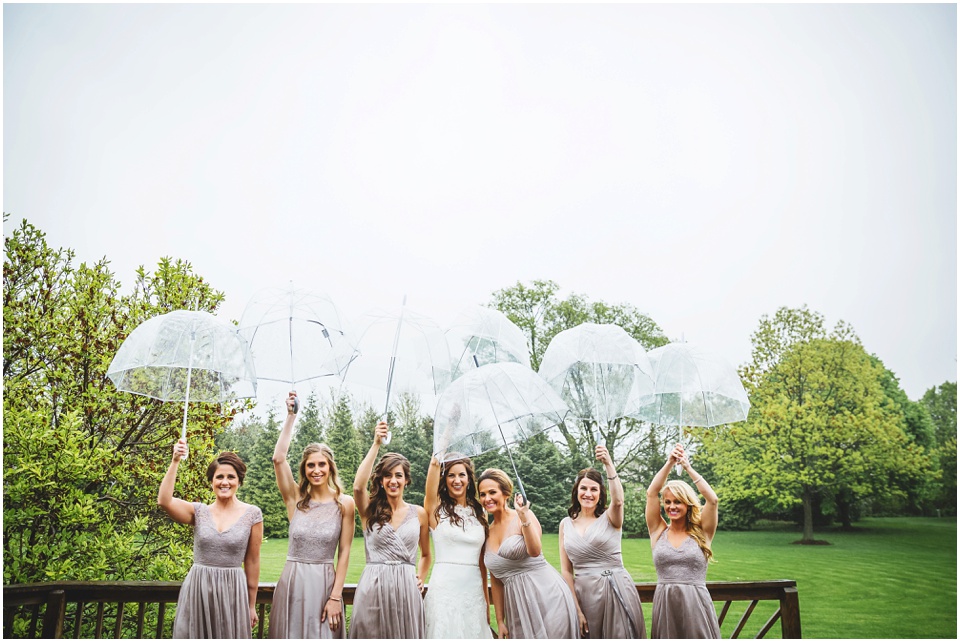 cathedral wedding photography, Bridesmaids with umbrellas.