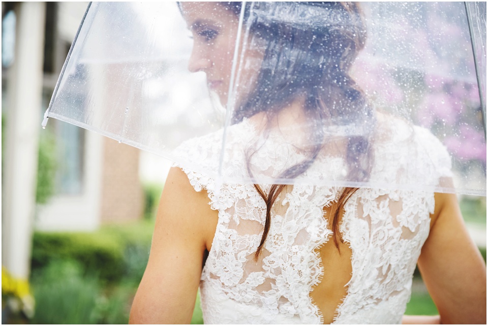 cathedral wedding photography, Detail of bride's lace dress and umbrella.