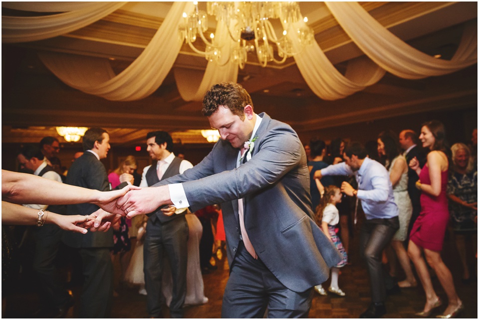 cathedral wedding photography, guests dancing and partying at wedding reception
