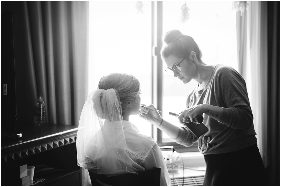 Bride getting makeup done for wedding day by Central Illinois Wedding Photographer Rachael Schirano