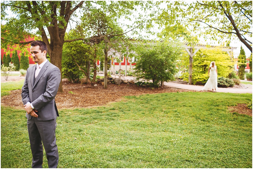 Bride and groom first look by Kickapoo Creek Winery Wedding Photographer Rachael Schirano