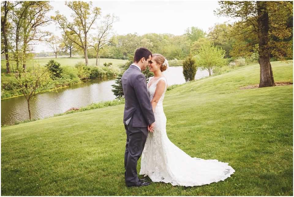 Bride and groom snuggling at Kickapoo Creek Winery by Wedding Photographer Rachael Schirano