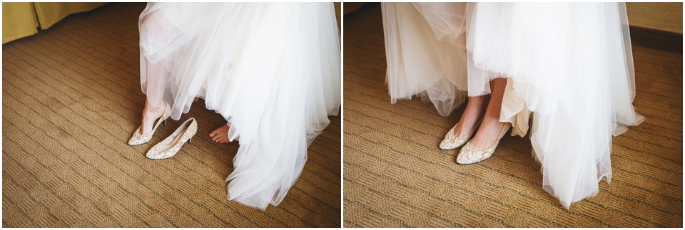 Bride putting on wedding shoes