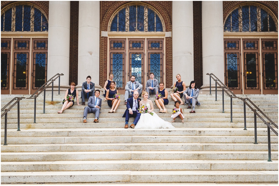 Trendy navy and gray wedding party photos on staircase