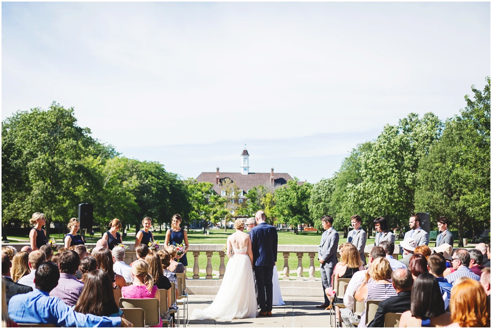 Bride and groom at wedding ceremony at Central Illinois mansion with overlook