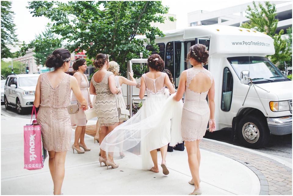 pear tree estates wedding photography, Bride and bridesmaid board a bus to wedding ceremony.