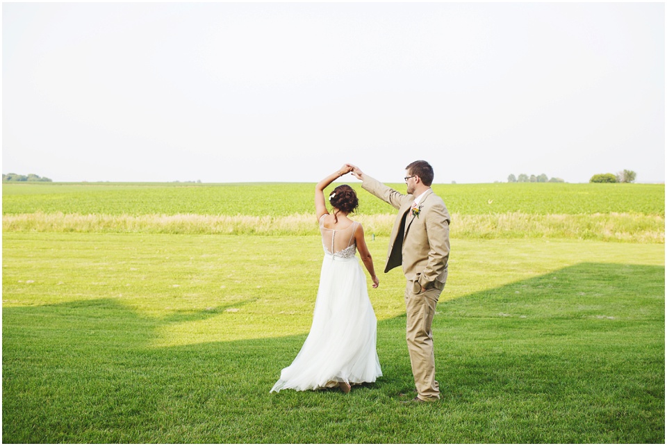 pear tree estates wedding photography, Bride and groom dancing in an open field.