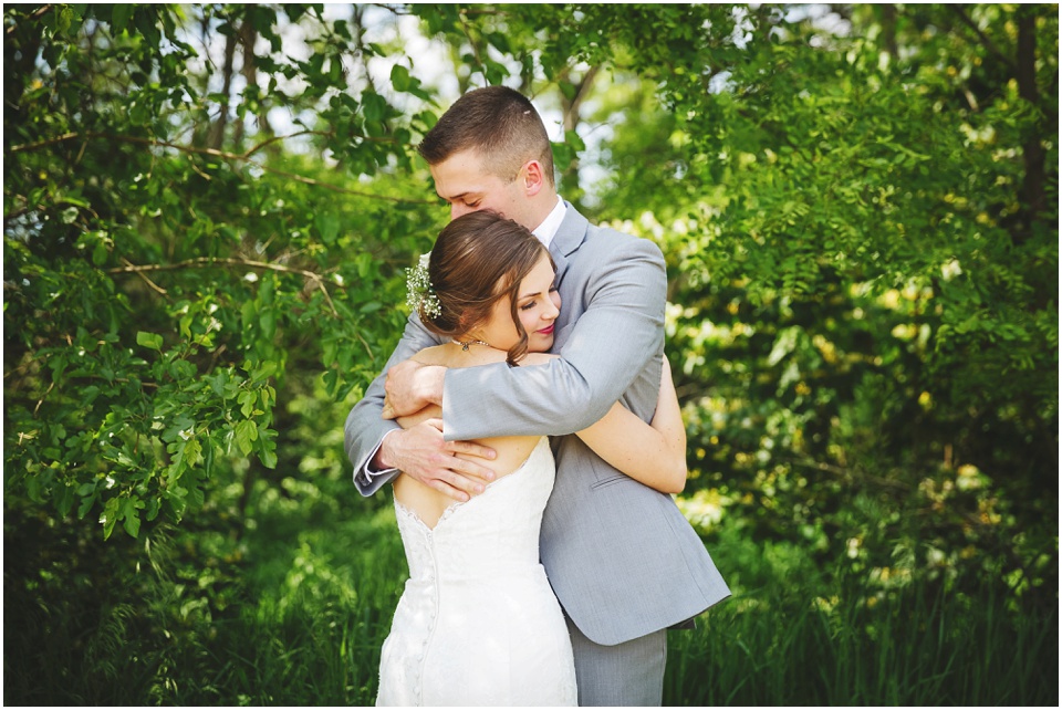 outdoor Illinois wedding photographer, Bride and groom first look at Comlara Park in Hudson, IL.