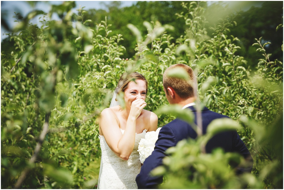 outdoor wedding photography, Bride and Groom first look in field of grass by Bloomington Illinois Wedding Photographer Rachael Schirano
