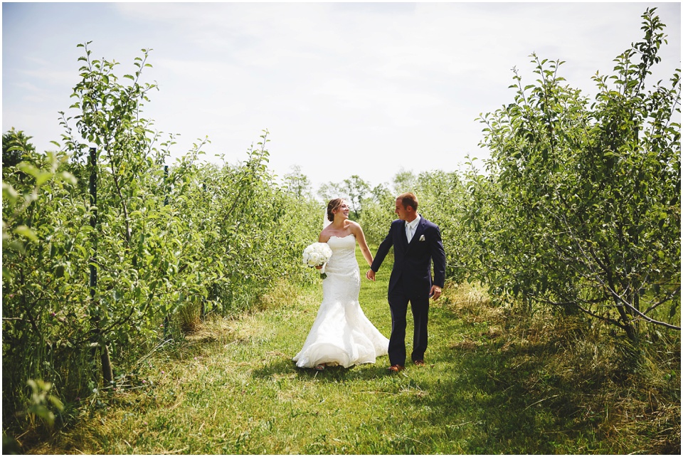 outdoor wedding photography, Bride and Groom first look in field of grass by Bloomington Illinois Wedding Photographer Rachael Schirano