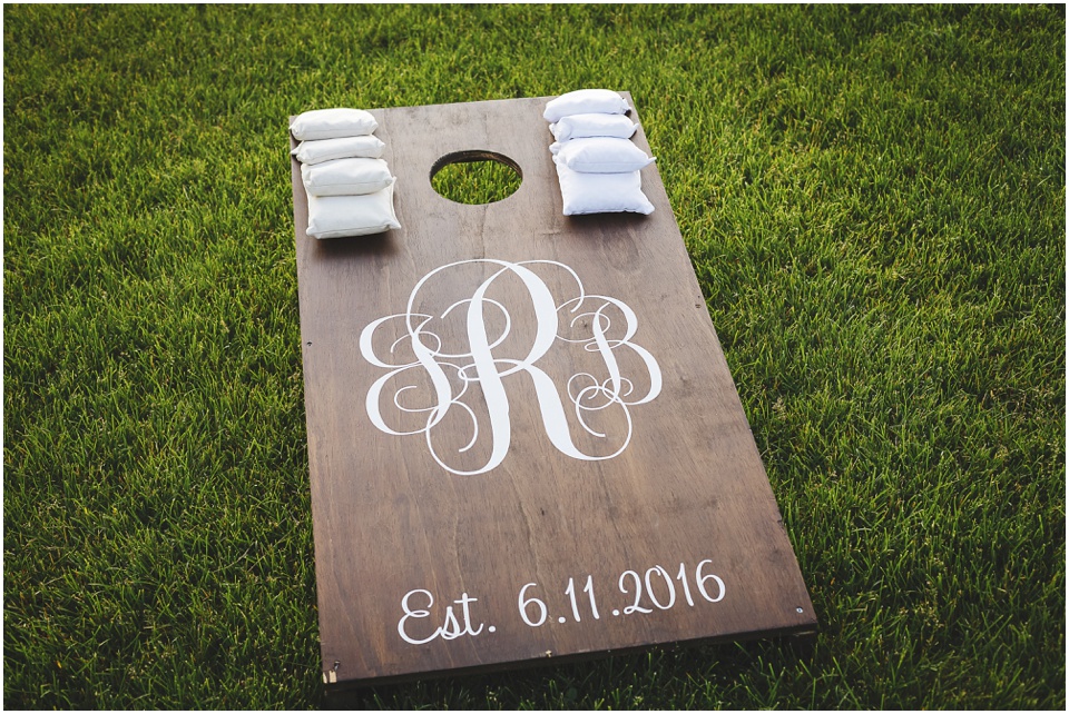 outdoor wedding photography, Personalized wedding cornhole game by Bloomington Illinois Wedding Photographer Rachael Schirano