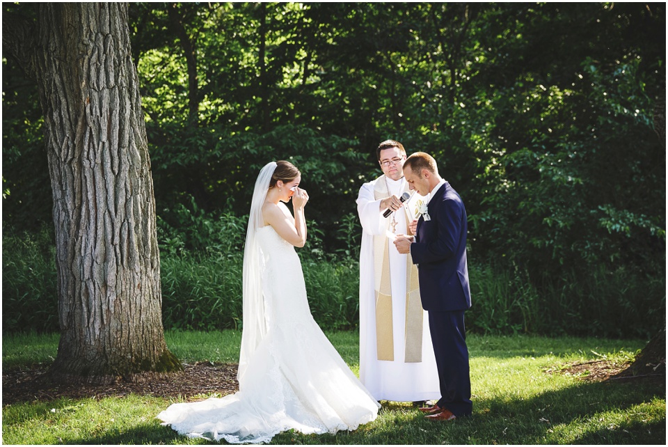 outdoor wedding photography, Bride and groom at wedding ceremony by Bloomington Illinois Wedding Photographer Rachael Schirano