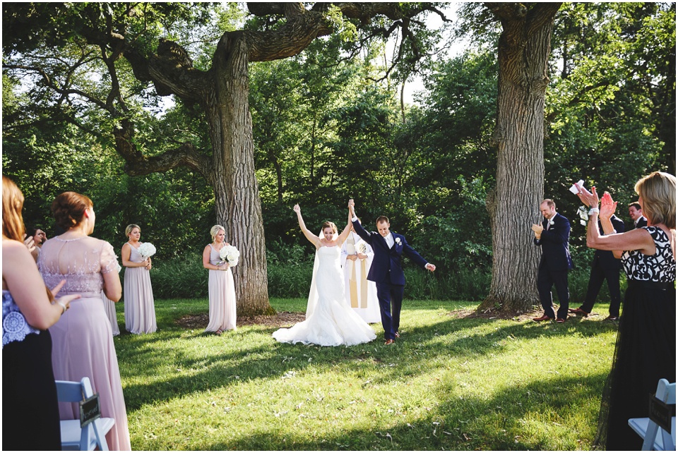 outdoor wedding photography, Bride and groom celebrate ceremony by Bloomington Illinois Wedding Photographer Rachael Schirano