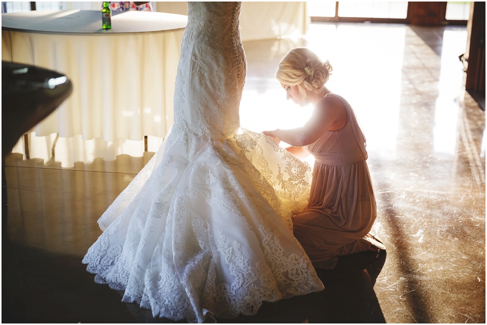 outdoor wedding photography, Bridesmaid bustles wedding dress by Bloomington Illinois Wedding Photographer Rachael Schirano