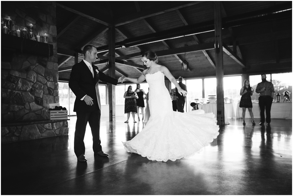 outdoor wedding photography, First dance twirling at wedding barn reception by Bloomington Illinois Wedding Photographer Rachael Schirano