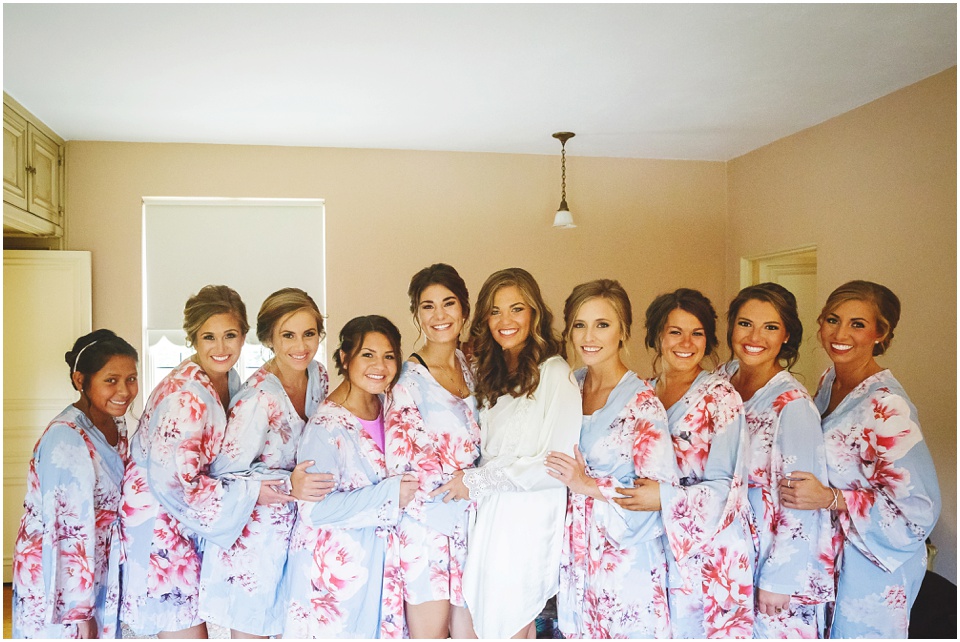 garden wedding photos, Bride and bridesmaids in floral robes.