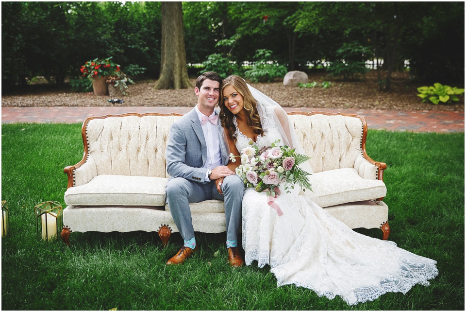 garden wedding photos, Bride and groom portraits on antique couch at Central Illinois wedding.