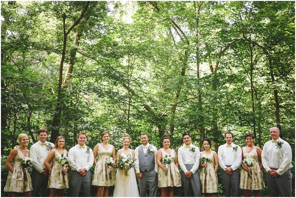 outdoor wedding photographer, Gold bridesmaids dresses, grey groomsmen suits and green ivy bouquets at chapel of the templed trees wedding in central illinois