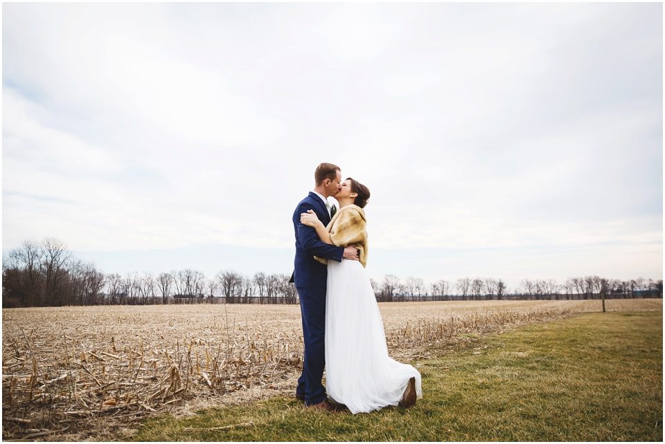 rustic winter wedding photography, Bride Groom Portraits in open field at Winter Wedding in Central Illinois by Rachael Schirano