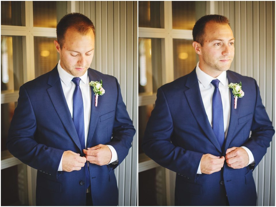 Wesleyan University Wedding photos, groom in navy suit buttoning jacket by Central Illinois Wedding Photographer Rachael Schirano