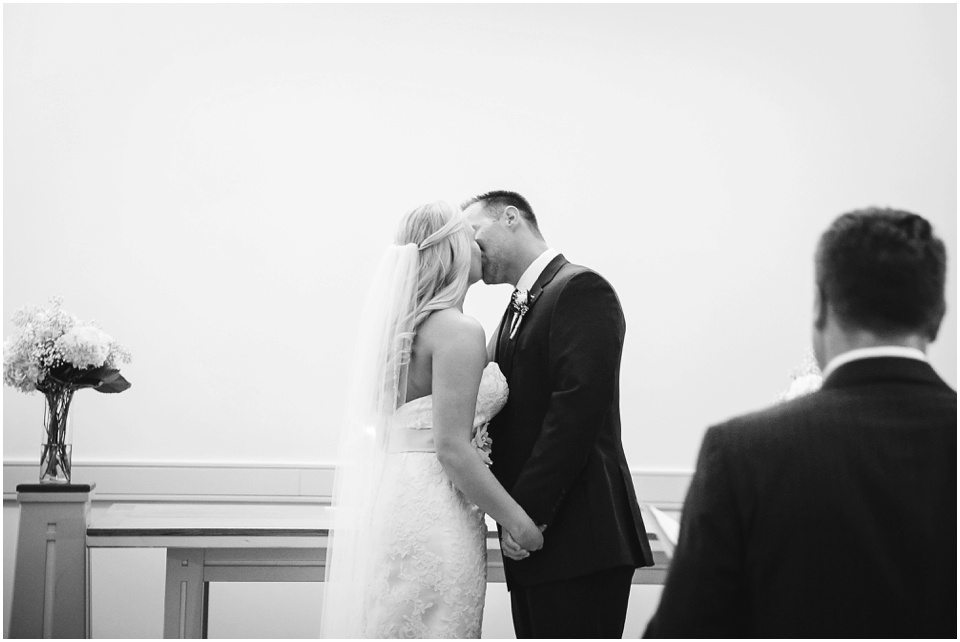 First kiss at Bloomington IL Church Wedding by Central Illinois Wedding Photographer Rachael Schirano