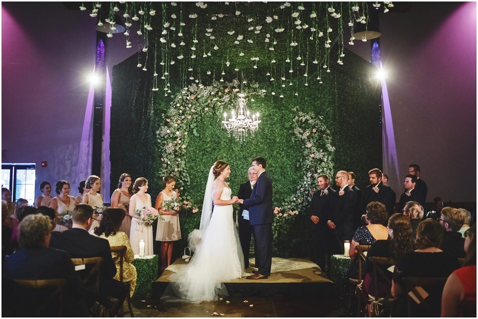 central illinois wedding photographer, Bloomington Illinois Wedding Ceremony with grass wall and flowers hanging from ceiling by Rachael Schirano