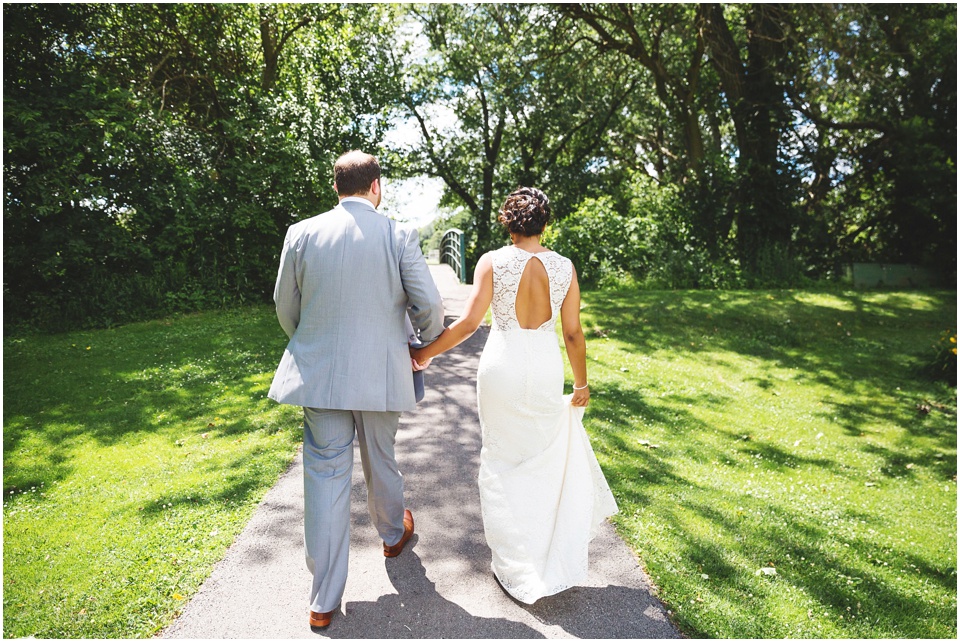 bride and groom first look under willow tree by Bloomington Illinois Wedding Photographer Rachael Schirano