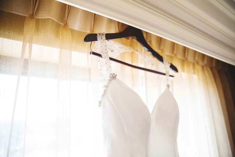 Springfield Illinois Wedding photography, bride's wedding dress hanging in window