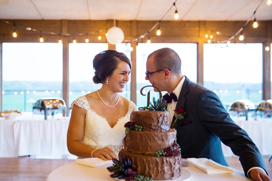 outdoor Illinois wedding photography, rustic wedding reception cake cutting, central illinois