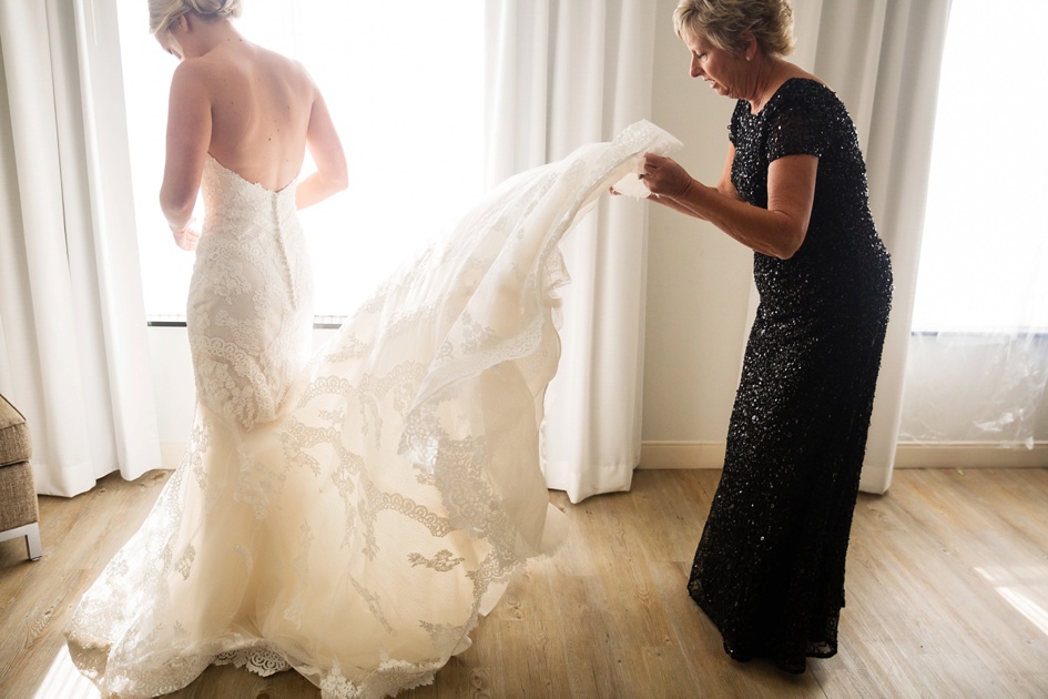 Bride getting into dress