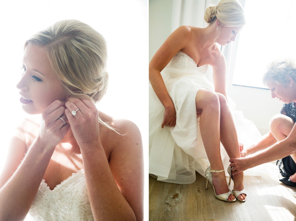 Bride putting on earrings and shoes
