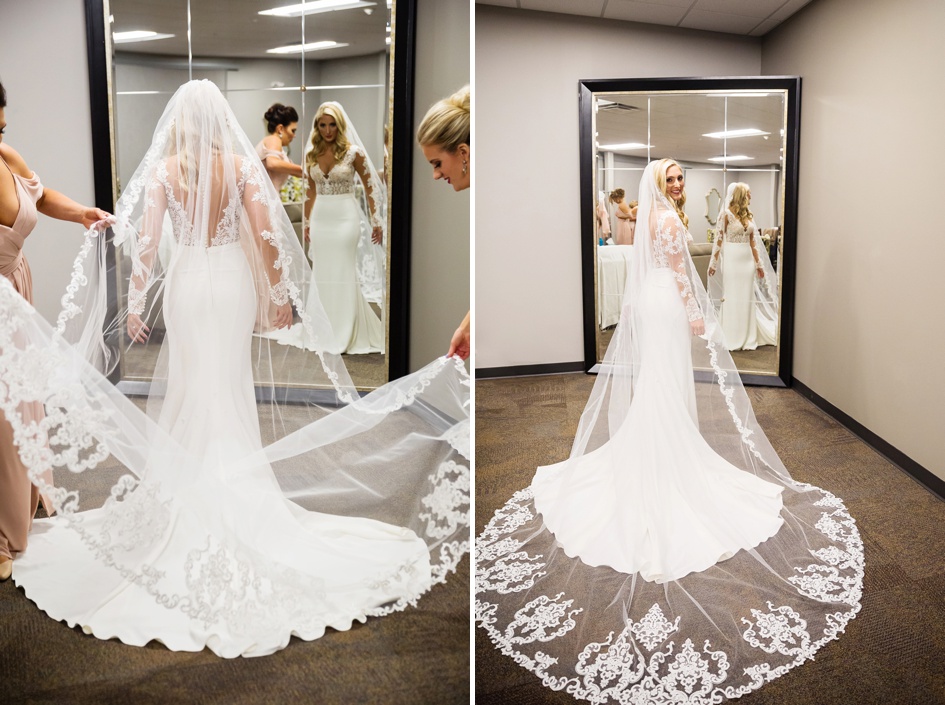 bride putting on lace floor length wedding veil