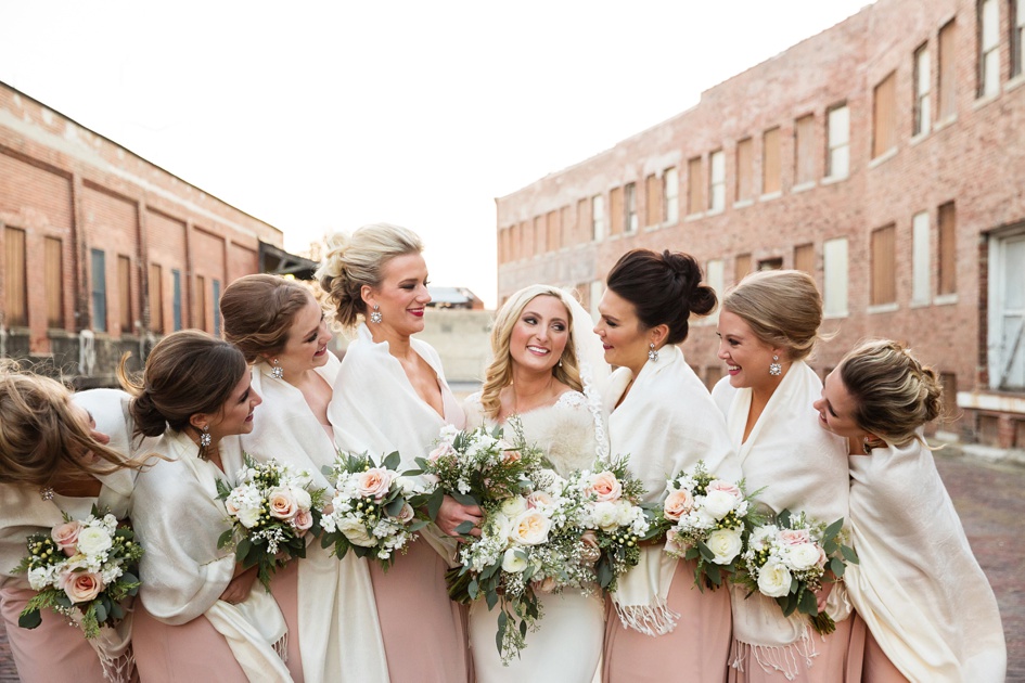 black and blush color winter bridal party photos with fur