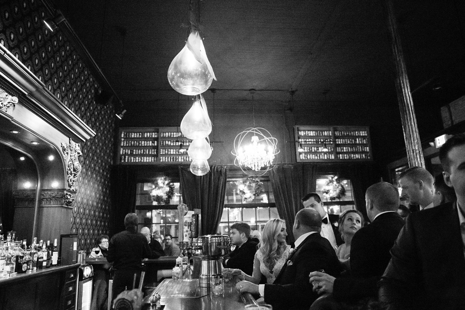 black and blush color winter bridal party photos at The Gin Mill bar