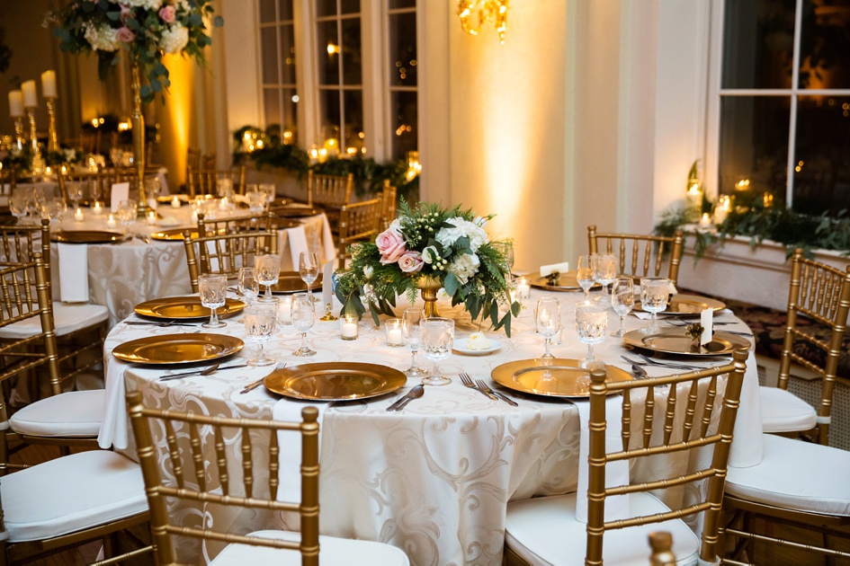 christmas themed gold and green wedding reception table settings