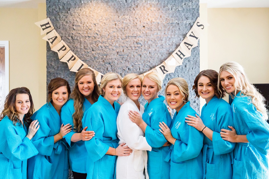 bride and bridesmaids with bright blue robes