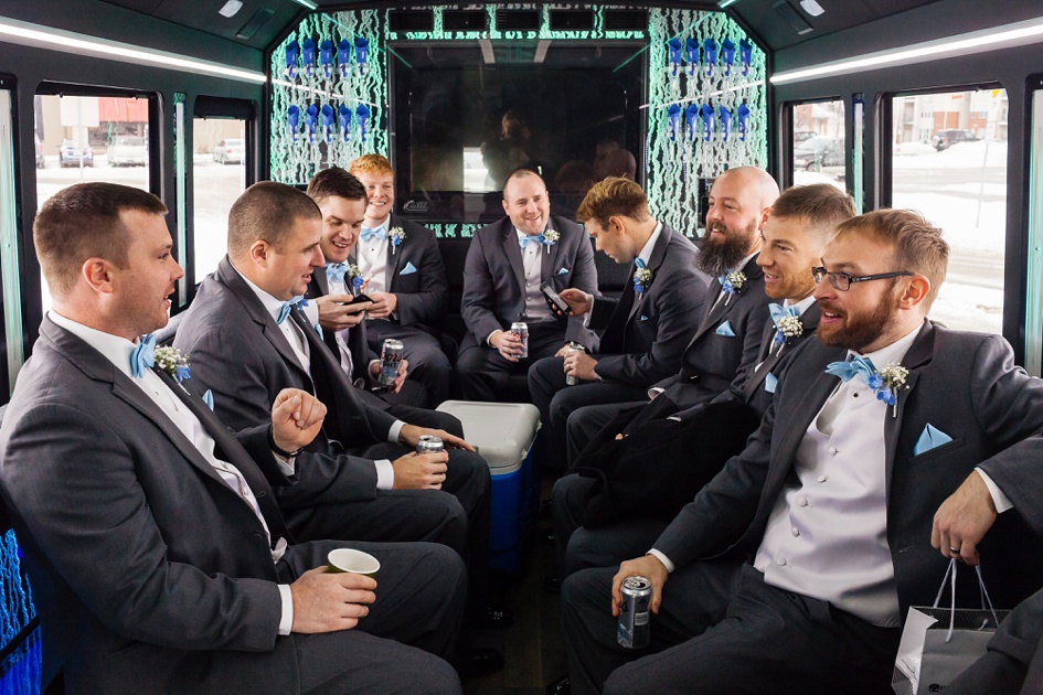 groom and groomsmen on wedding bus