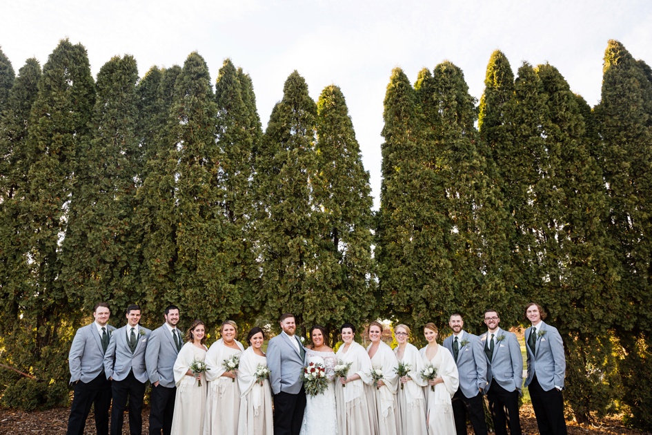 bridal party photos with tall pine trees
